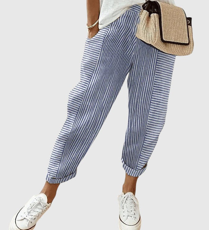 Nina pinstriped trousers in blue and white with ankle cuffs