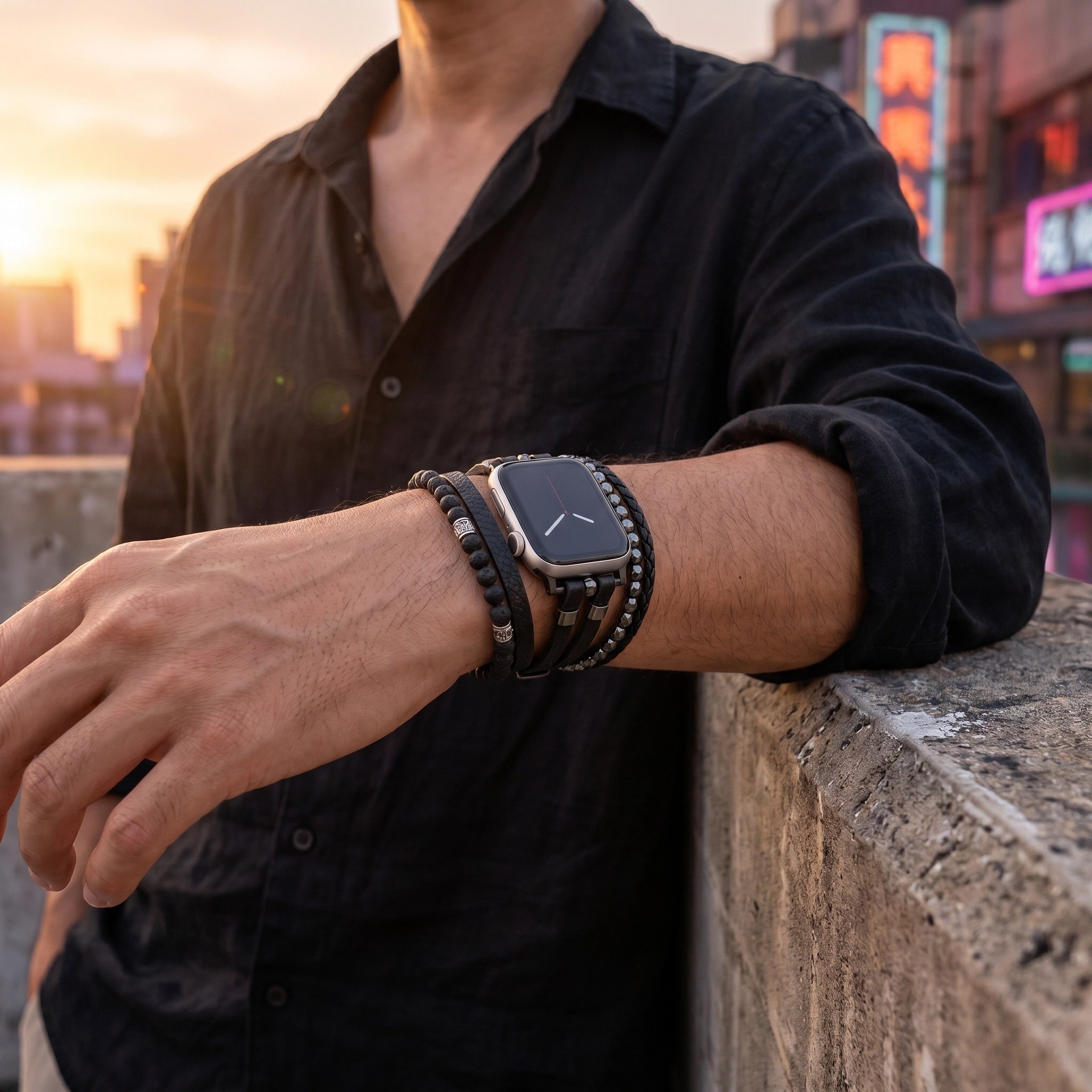 Black multi-wrap Apple Watch bracelet with volcanic stone beads and stainless steel clasp