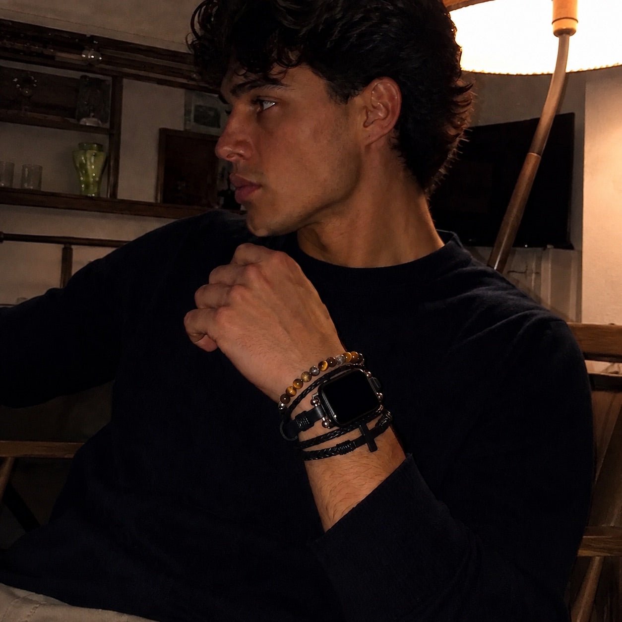 Black multi-row watch bracelet with cross charm and braided straps