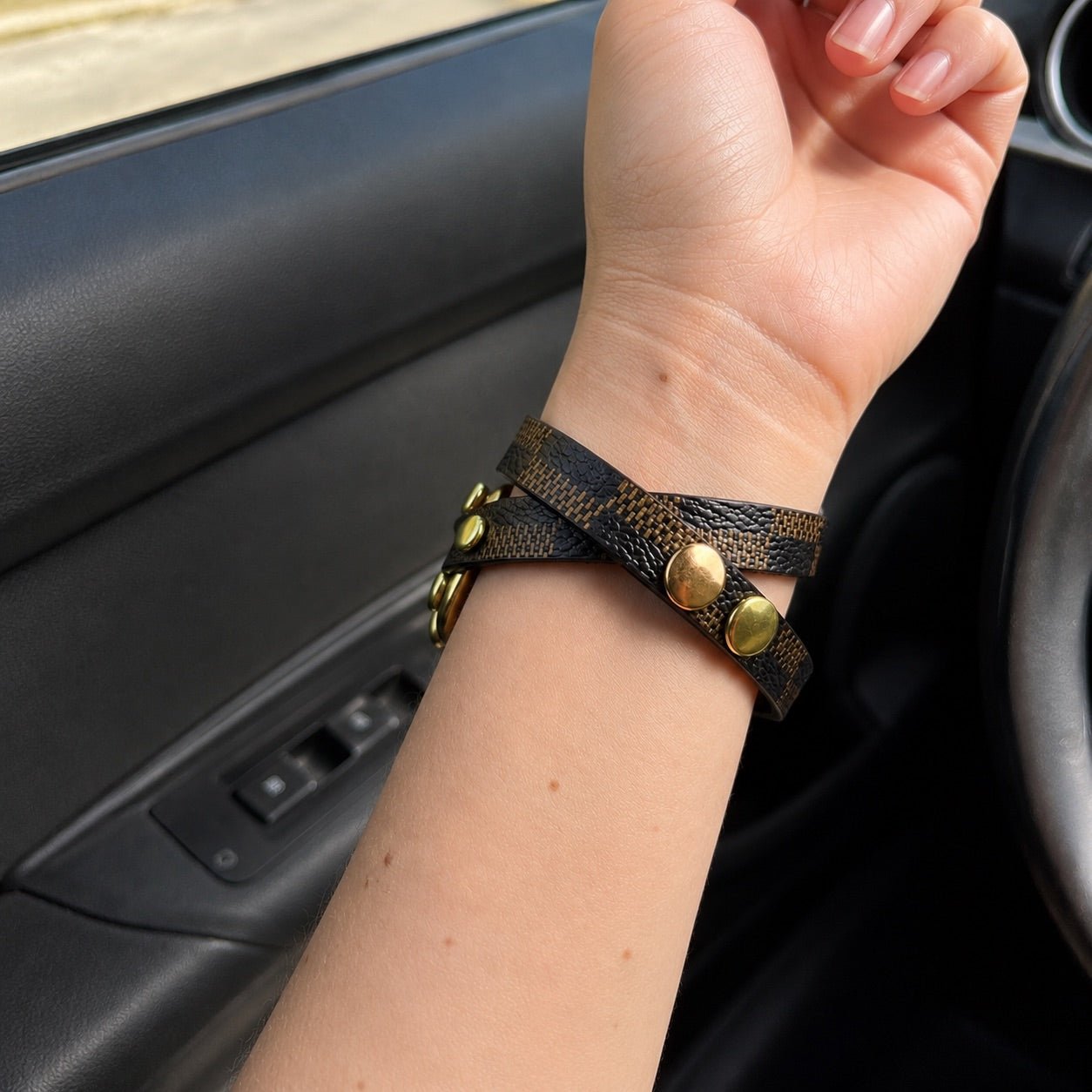 Brown patterned Apple Watch strap with gold Cuban-link chain and adjustable clasp