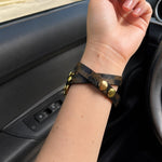 Brown patterned Apple Watch strap with gold Cuban-link chain and adjustable clasp