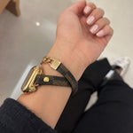 Brown patterned double-wrap Apple Watch strap with gold clasp and chain details