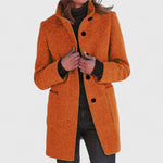 Orange classic button-front coat with notch lapels, long sleeves, and side pockets