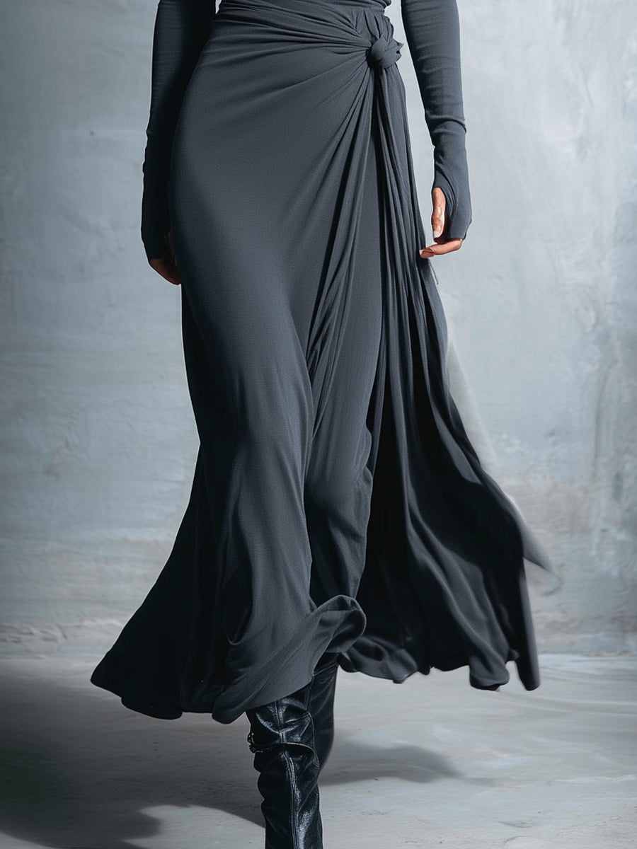Charcoal gray maxi silk dress with side drape and knotted waist detail, long sleeves