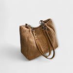 Tan ribbed shoulder bag with chain straps and front label