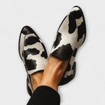 Cow-print leather loafer with black apron and low heel