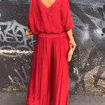 Two-piece chiffon set with draped V-neck blouse and wide-leg pants, bright red.