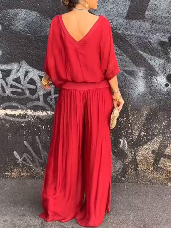 Two-piece chiffon set with draped V-neck blouse and wide-leg pants, bright red.