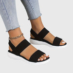 Black orthopedic sandals with two wide straps, open toe, cushioned white sole