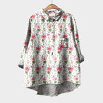 Floral button-up blouse with collar, long sleeves, and chest pocket, white base