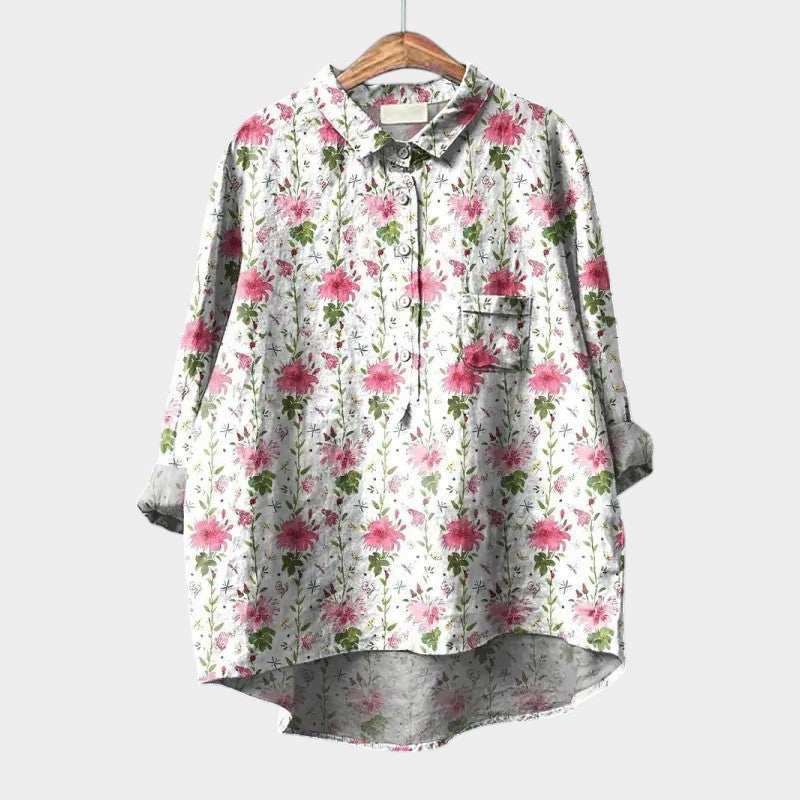 Floral button-up blouse with collar, long sleeves, and chest pocket, white base