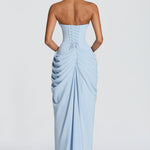 Back view of light blue strapless corset maxi dress with gathered drape