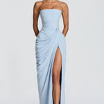 Light blue strapless maxi gown with corset bodice, draped overlay, side slit