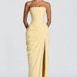Strapless pale yellow corset maxi dress with side draping and center front slit