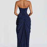 Back view of navy strapless corset maxi dress with gathered draped details