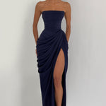 Navy strapless corset maxi dress with draped overlay and high front slit