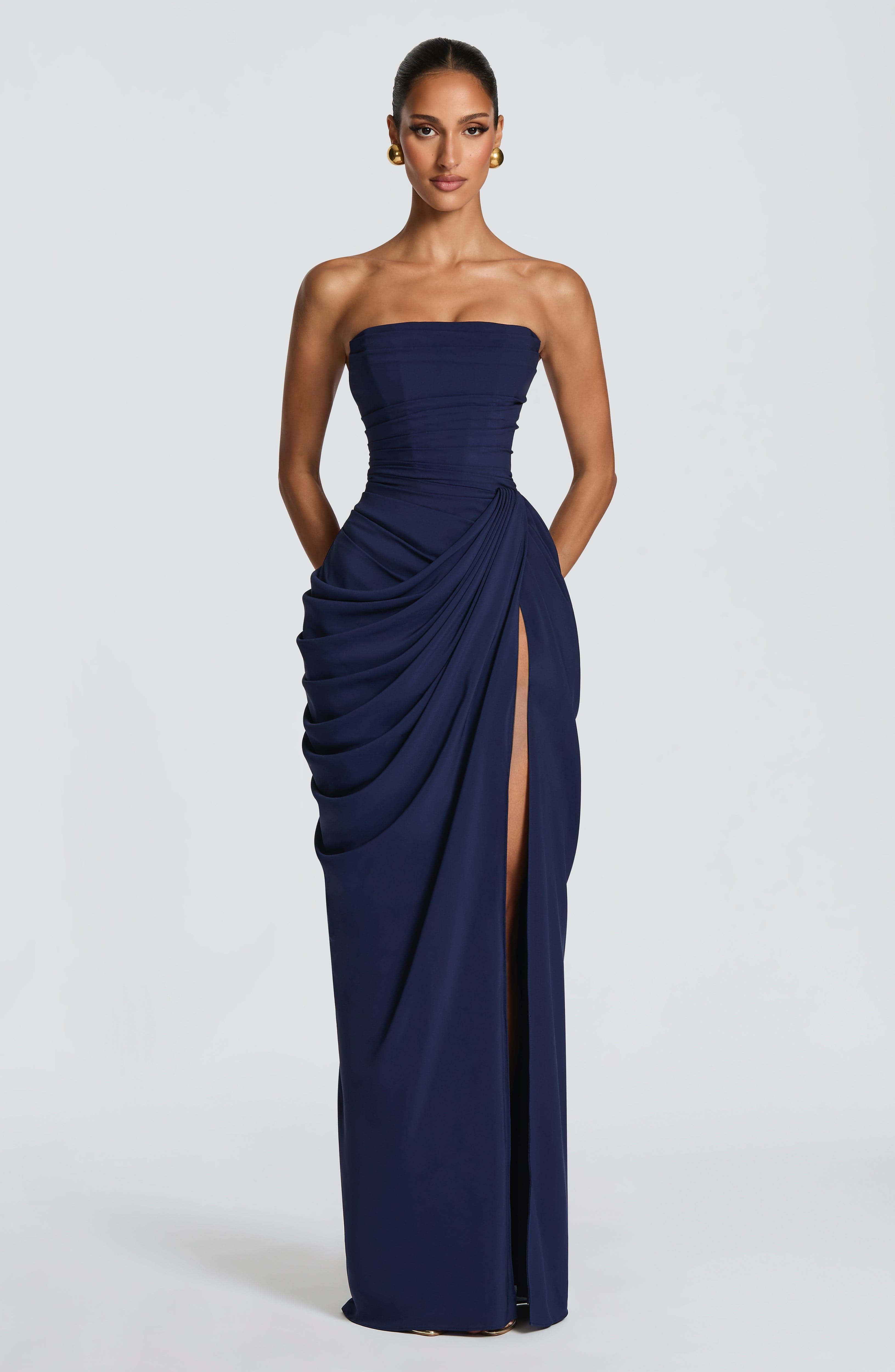 Navy strapless corset maxi gown with ruched waist and draped front slit