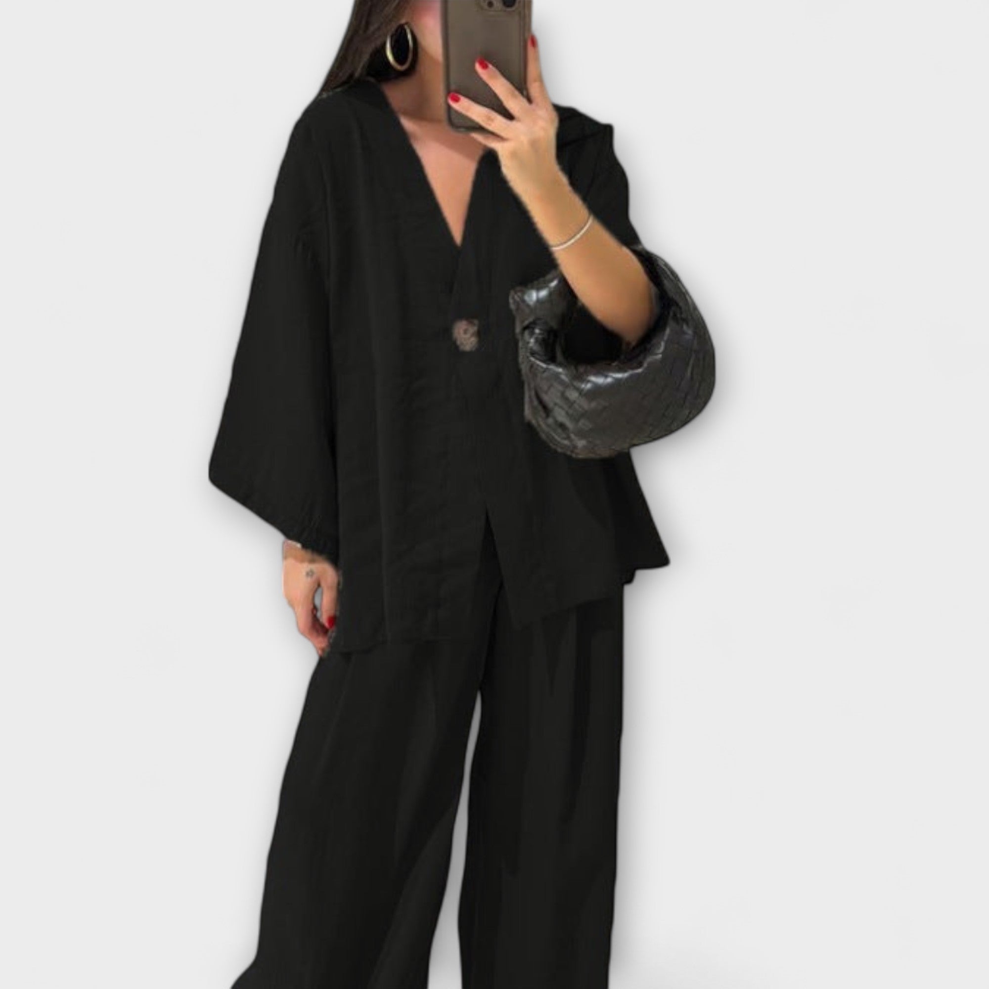 Black layered V-neck top and wide-leg pants set with button front