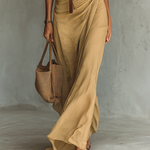 Khaki draped maxi dress with V-neck buttons and belted waist; long skirt and sleeves