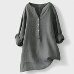 Light gray comfort shirt with V-neck, button front, and loose cuffed sleeves