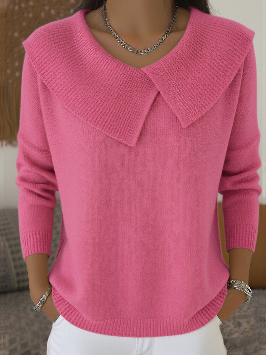 Pink knit sweater with soft fold-over collar and V-neck, long sleeves