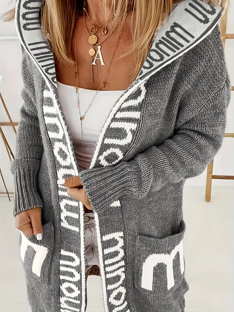 Light gray open-front knit cardigan with white geometric trim, long sleeves, front pockets