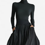 Black turtleneck maxi dress with long sleeves, ruched waist, and gathered full skirt