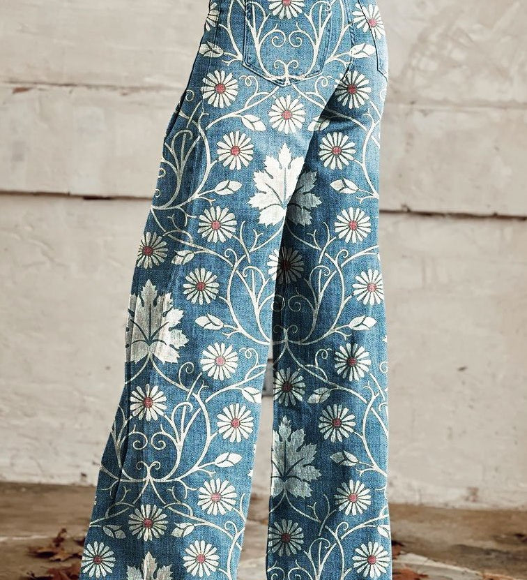 Wide-leg boho trousers with blue fabric and white daisy floral vine pattern