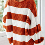 Women's winter sweater with orange and white horizontal stripes, ribbed knit crewneck