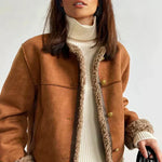 Brown jacket with sherpa-lined placket and gold buttons; warm high collar