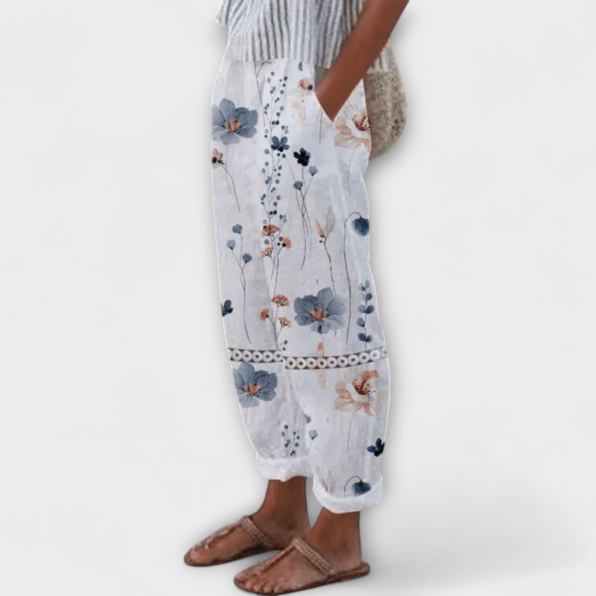 Wide-leg floral printed pants in light blue with border trim, elastic waist