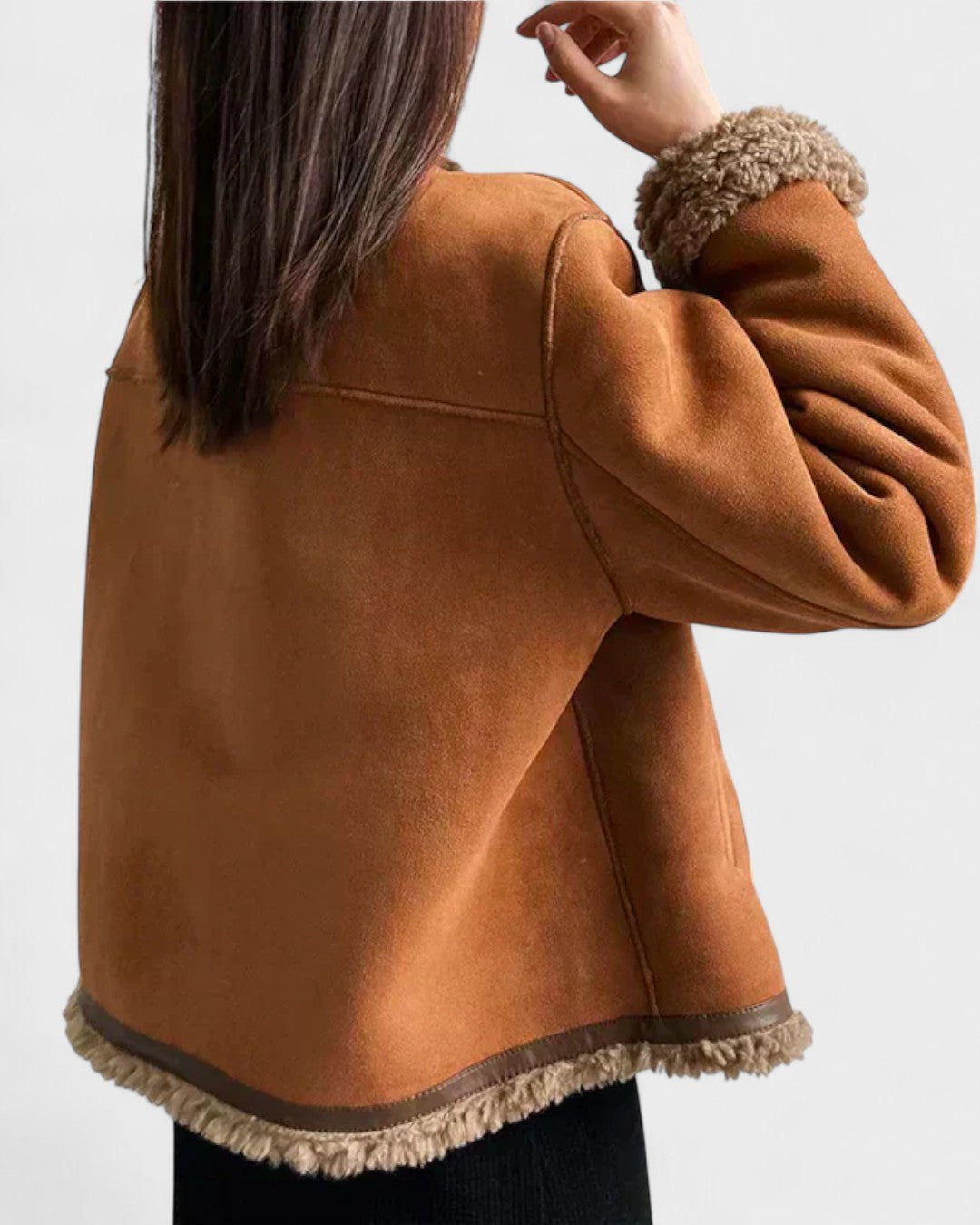Brown suede coat with shearling-trim collar and scalloped hem