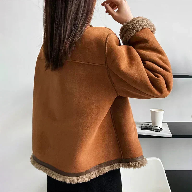 Brown sherpa-lined jacket back with curved hem trim