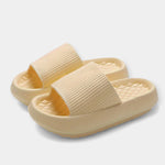Cream/beige textured slide sandals with wide strap and thick cushioned sole