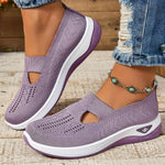 Lavender orthopedic knit slip-on sneakers with side cutouts and white cushioned sole
