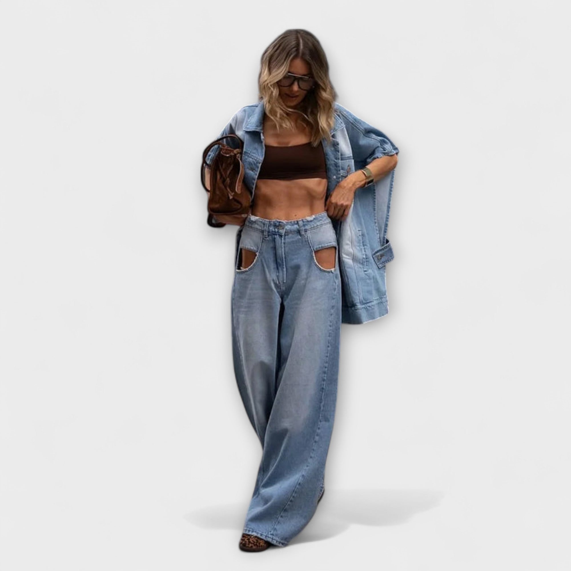 Light-wash denim wide-leg jeans with patch pockets, worn with open denim jacket