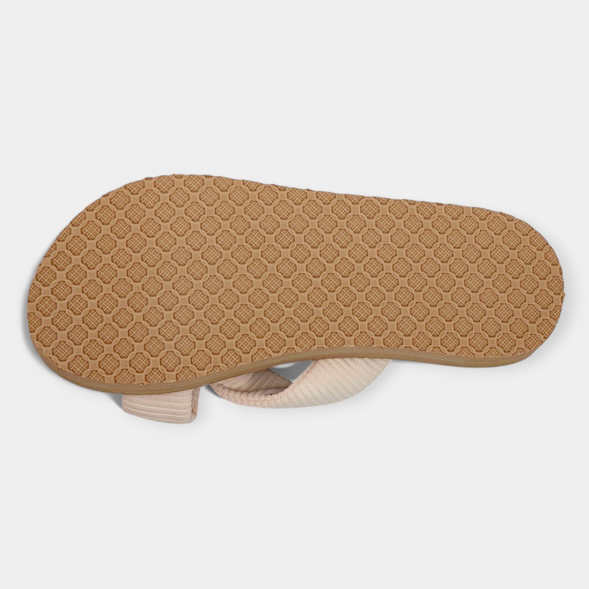 Wide bow sandals outsole view with textured tan sole and visible cream upper edge