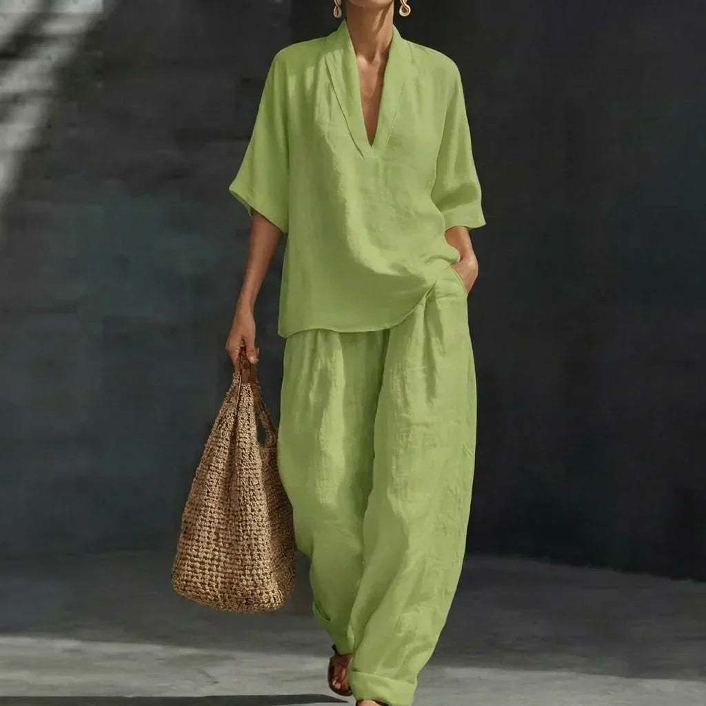 Green women’s two-piece set with V-neck short-sleeve top and loose wide-leg pants