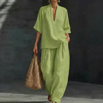 Green women’s two-piece set with V-neck short-sleeve top and loose wide-leg pants