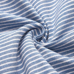 Close-up of blue and white striped knit fabric with gathered texture