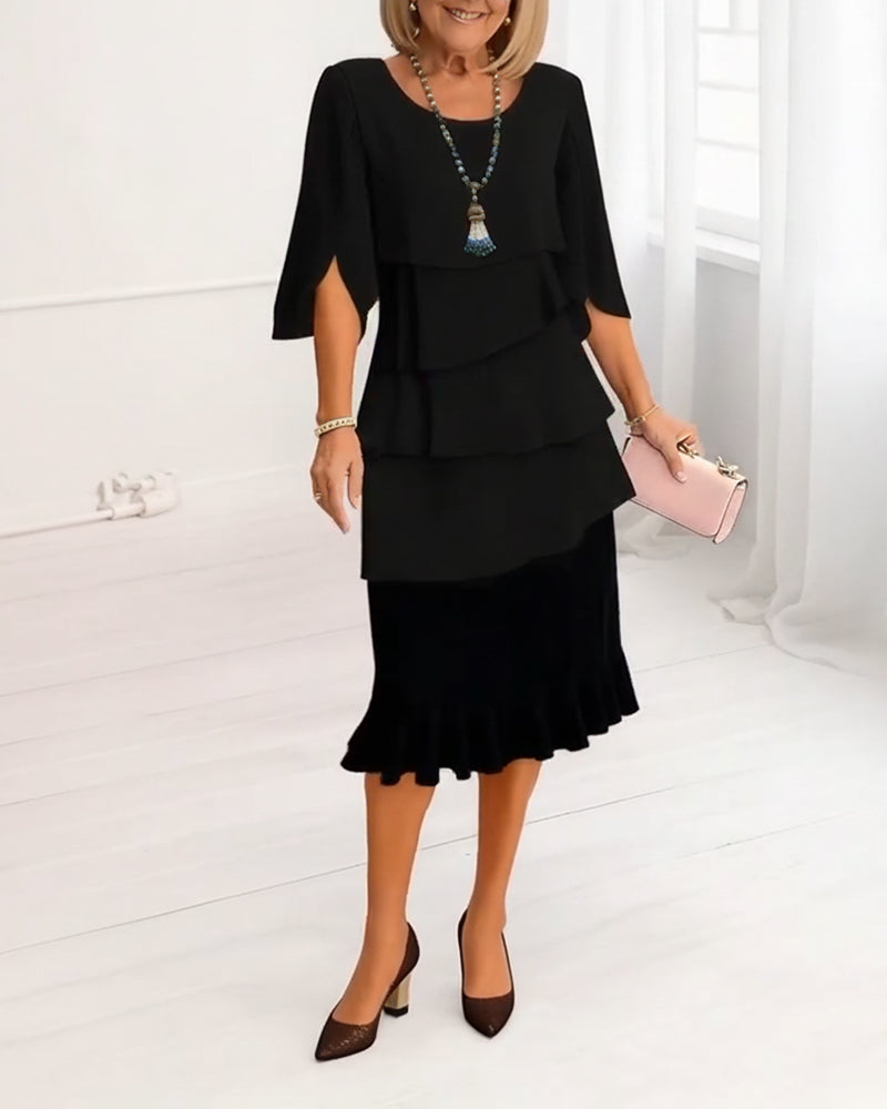Black tiered ruffle midi dress with short cape sleeves and layered bodice