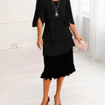 Black tiered ruffle midi dress with short cape sleeves and layered bodice