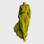 Green knit turtleneck sweater and draped maxi skirt set with gathered waist
