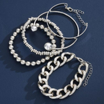 Silver-tone overlapping bracelet set with beaded bracelets, hoops, and chain links (5 pieces)