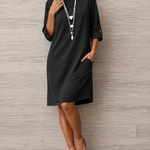 Black midi shift dress with 3/4 sleeves and round neckline