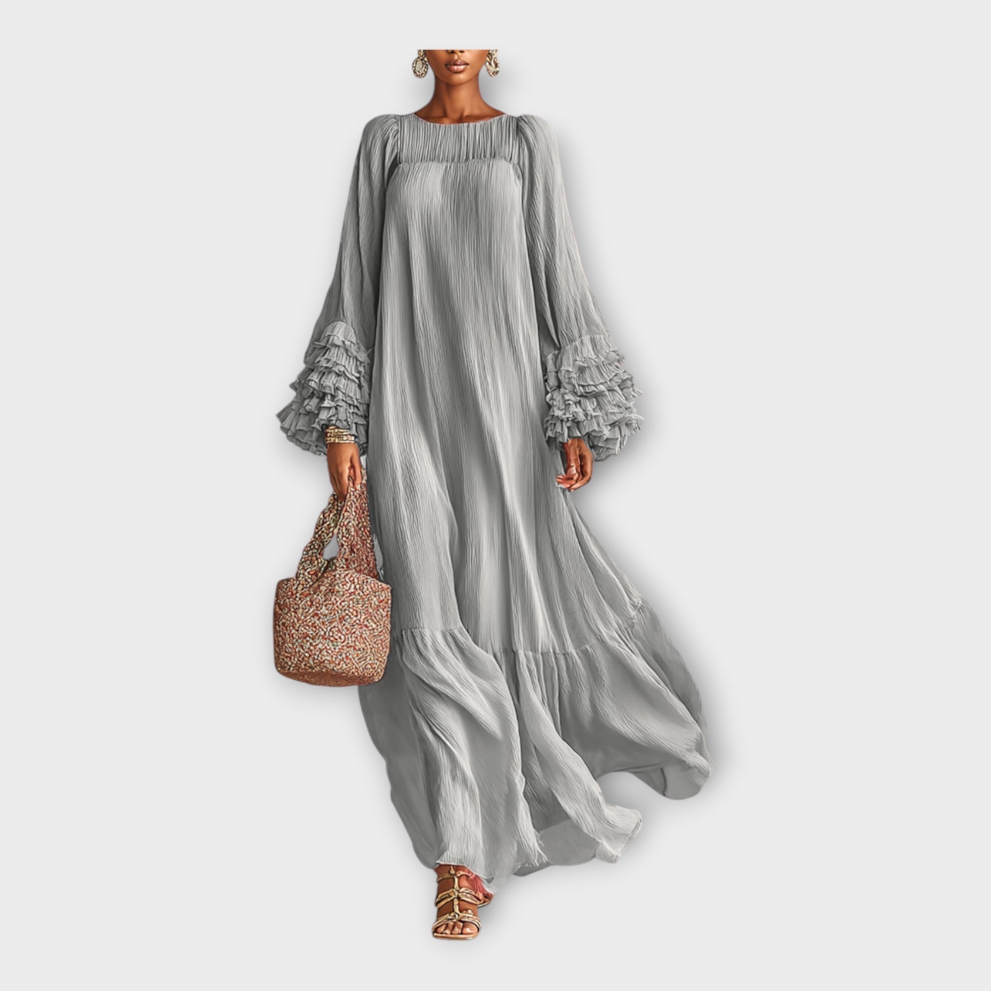 Long gray flowy maxi dress with gathered shoulders and tiered skirt hem