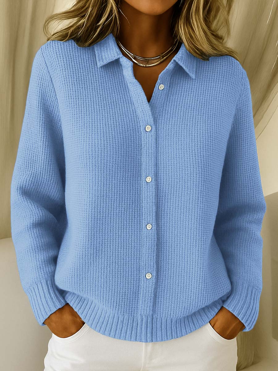 Blue knit cardigan with collared button front and ribbed cuffs and hem.