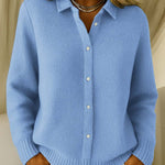 Blue knit cardigan with collared button front and ribbed cuffs and hem.