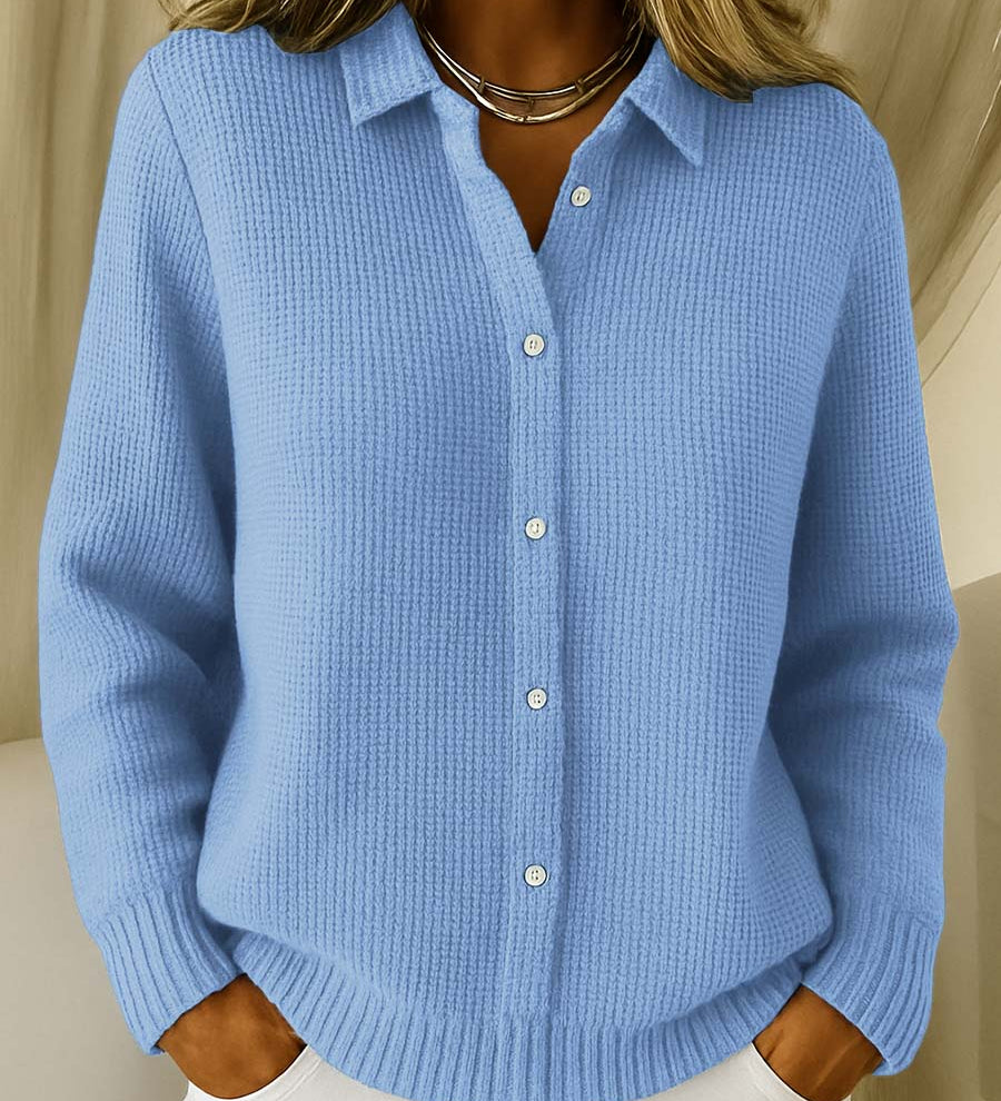 Blue knit cardigan with collared button front and ribbed cuffs and hem.