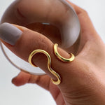 Gold-tone asymmetric wave statement ring with curled, open-loop design